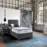 Легло на крачета с атрактивна визия в сив цвят единична база, интериор